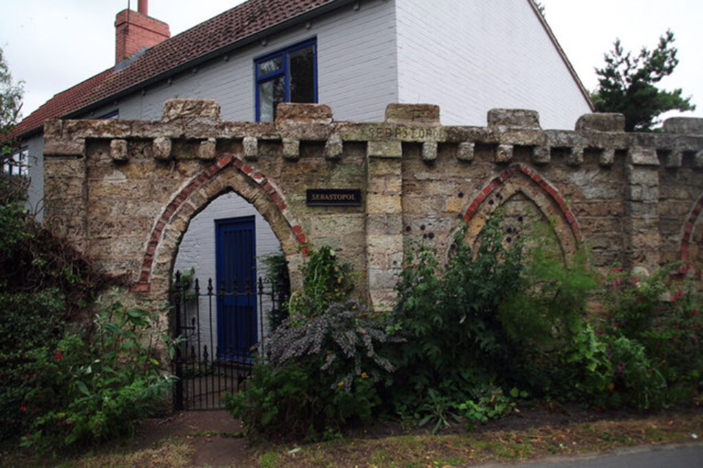 The Sebastopol Wall at Ellerker in the East Riding: “This wall round Sebastopol Cottage was built in 1857 by the owner of Ellerker Hall. He had shipped arms to Sebastopol in the Crimea and used ballast on the way home, and this was used to build the wall in order to hide the owner from view of the Hall when she used the privy”
